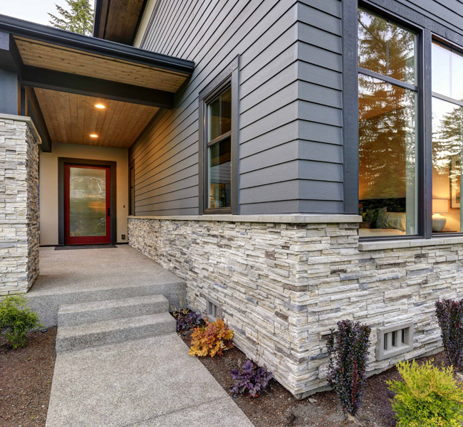 Beautiful stucco home exterior by Garden State Brickface